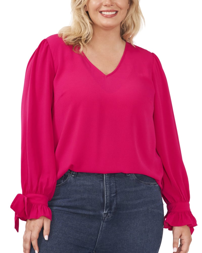 Front of a model wearing a size 1X Isla Tie-Sleeve Blouse in BRT GERANIUM by CeCe. | dia_product_style_image_id:263387